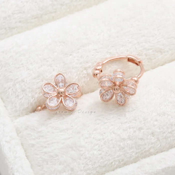 from J Shop CZ Daisy Huggie Earrings Earrings