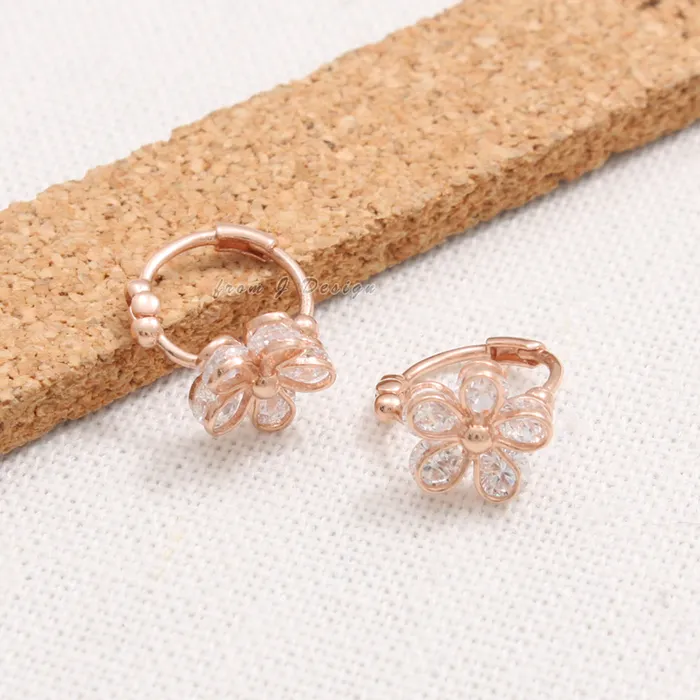 from J Shop CZ Daisy Huggie Earrings Earrings