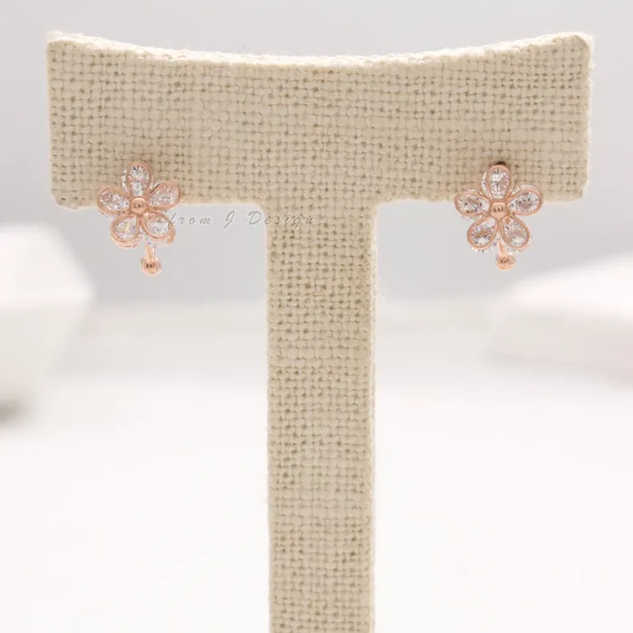 from J Shop CZ Daisy Huggie Earrings Earrings