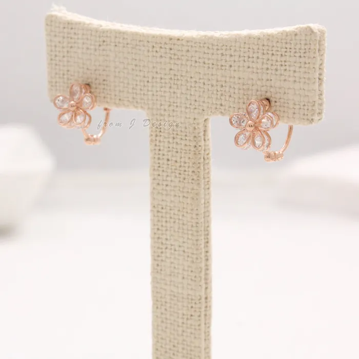 from J Shop CZ Daisy Huggie Earrings Earrings