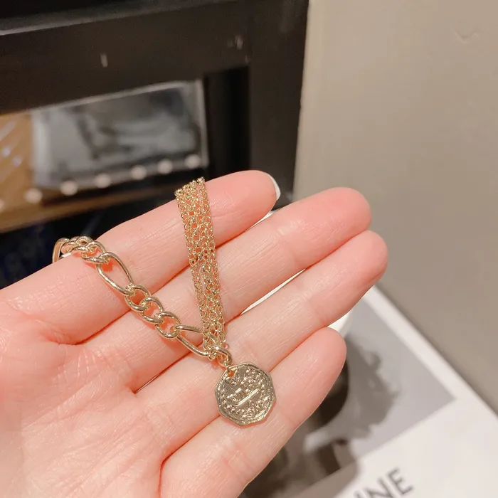 Bracelets Refined by AnnaKaci Asymmetrical Gold Chain Bracelet with Coin Bracelets Refined by AnnaKaci Asymmetrical Gold Chain Bracelet with Coin