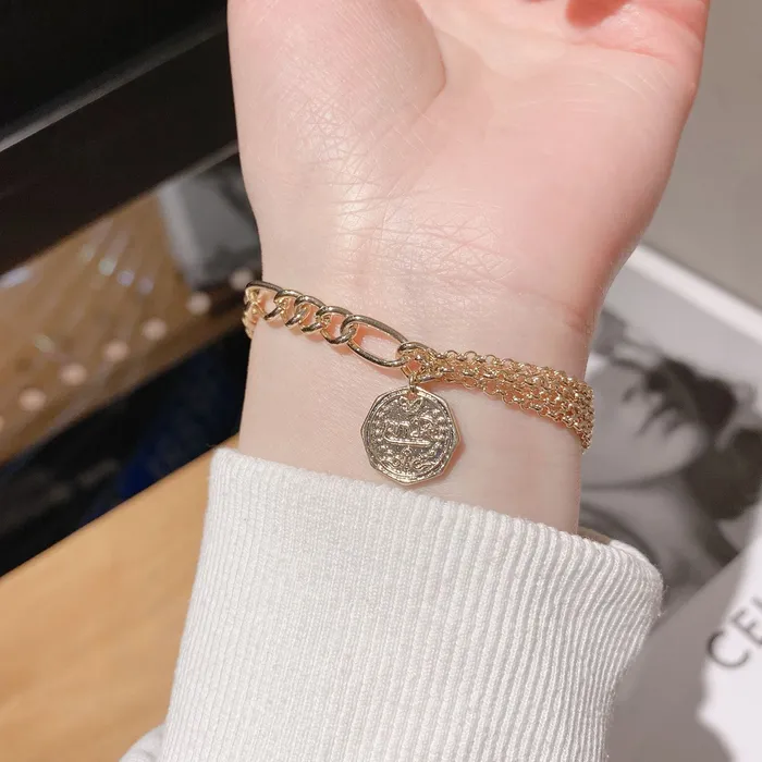 Bracelets Refined by AnnaKaci Asymmetrical Gold Chain Bracelet with Coin Bracelets Refined by AnnaKaci Asymmetrical Gold Chain Bracelet with Coin